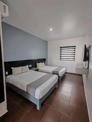 Cama o camas de una habitación en Aló Select Mazatlan