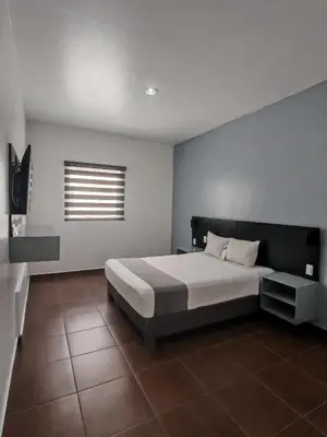 Cama o camas de una habitación en Aló Select Mazatlan
