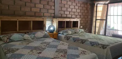 Cama o camas de una habitación en Hotel Villa de Urike