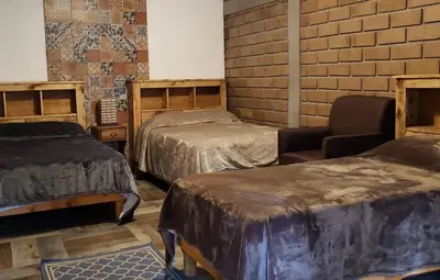 Cama o camas de una habitación en Hotel Villa de Urike