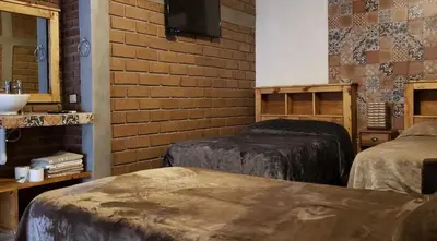 Cama o camas de una habitación en Hotel Villa de Urike