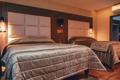 Cama o camas de una habitación en KAVIA MEOQUI HOTEL & SUITES
