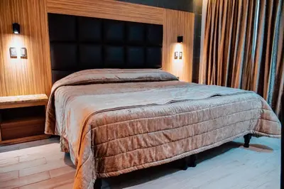Cama o camas de una habitación en KAVIA MEOQUI HOTEL & SUITES