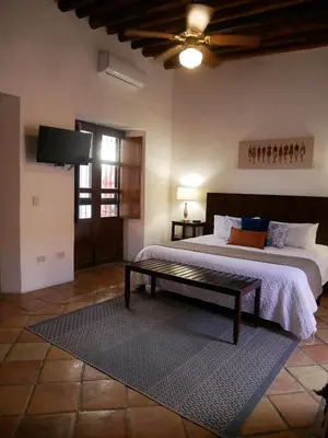 Cama o camas de una habitación en Hotel El Farol