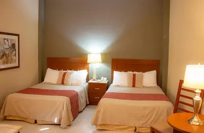 Cama o camas de una habitación en Hotel Fenix
