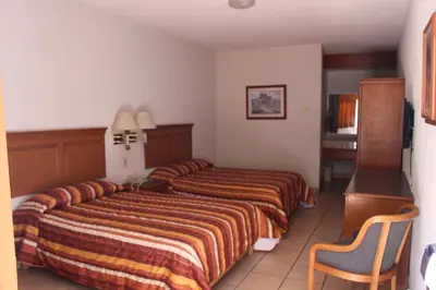 Cama o camas de una habitación en Hotel La Villa