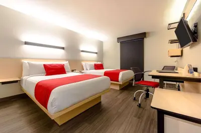 Una televisión o centro de entretenimiento en Comfort Inn Delicias