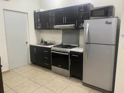 Una cocina o zona de cocina en Departamento para familias