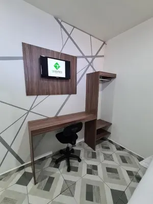 Una televisión o centro de entretenimiento en Hotel Town Express