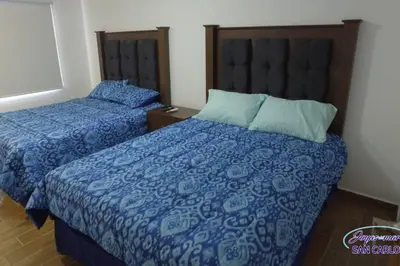Cama o camas de una habitación en Departamento Turquesa 1 Joyas del mar San Carlos