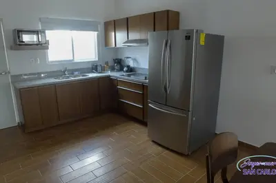 Una cocina o zona de cocina en Departamento Turquesa 1 Joyas del mar San Carlos