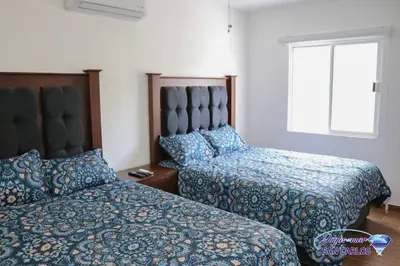 Cama o camas de una habitación en Departamento Turquesa 2 Joyas del Mar