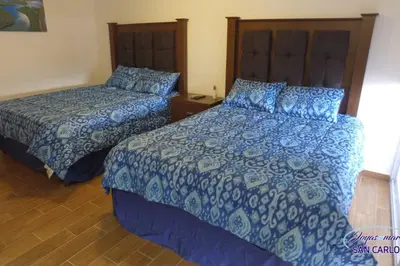Cama o camas de una habitación en Departamento Turquesa 3 joyas de mar San Carlos