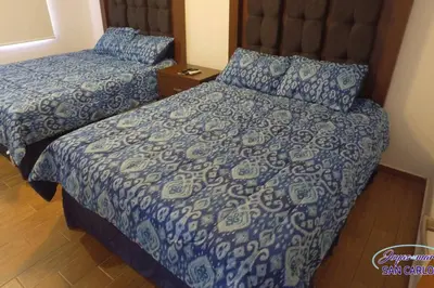 Cama o camas de una habitación en Departamento Turquesa 3 joyas de mar San Carlos