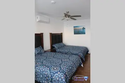 Cama o camas de una habitación en Departamento Turquesa 4 Joyas de San Carlos