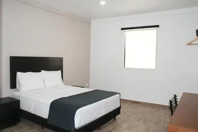 Cama o camas de una habitación en Hotel Capital Frontera