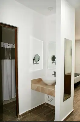 Cama o camas de una habitación en Hotel Capital Frontera