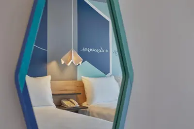 Cama o camas de una habitación en One Chihuahua Norte