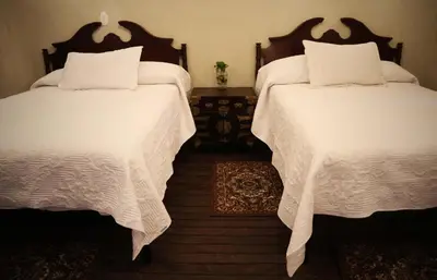 Cama o camas de una habitación en La Casa del General Hotel Boutique