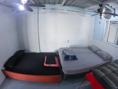 Cama o camas de una habitación en Mini Hostal Cultural de Mazatlán