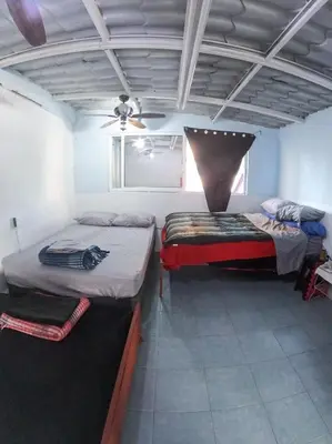 Cama o camas de una habitación en Mini Hostal Cultural de Mazatlán