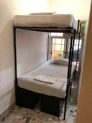 Cama o camas de una habitación en Mini Hostal Cultural de Mazatlán