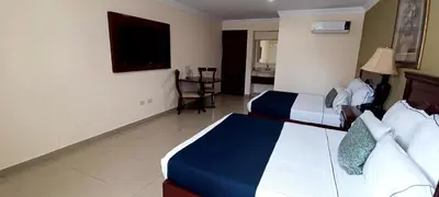 Cama o camas de una habitación en Hotel Confort Plaza
