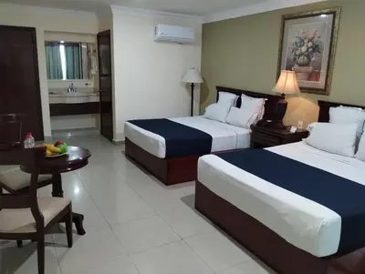 Cama o camas de una habitación en Hotel Confort Plaza