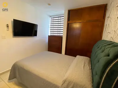 Una televisión o centro de entretenimiento en Acogedor cerca de la playa by G p s rentas