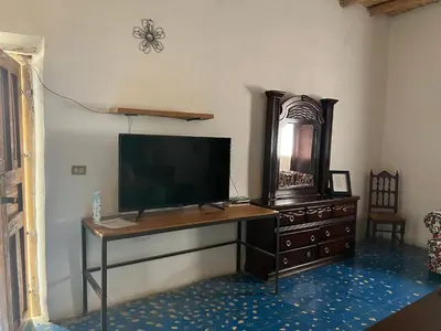 Una televisión o centro de entretenimiento en Casa Díaz Habitacion Zafiro