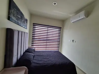 Cama o camas de una habitación en Hermoso departamento con alberca, a 10 minutos de la playa!!!