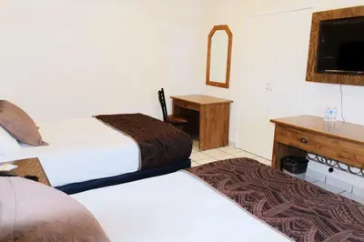 Cama o camas de una habitación en Hotel Sntenario