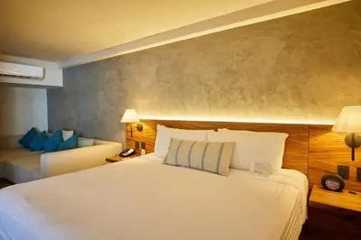 Cama o camas de una habitación en Emporio Mazatlan