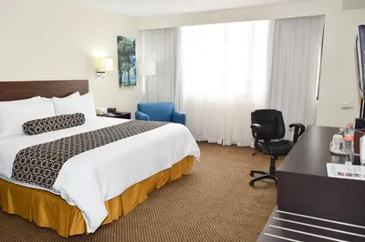 Cama o camas de una habitación en Wyndham Executivo Culiacan