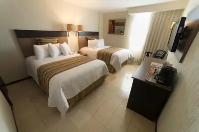 Cama o camas de una habitación en Ramada Hola Culiacan