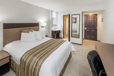 Cama o camas de una habitación en Ramada Hola Culiacan