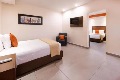 Cama o camas de una habitación en Hotel Buen Valle