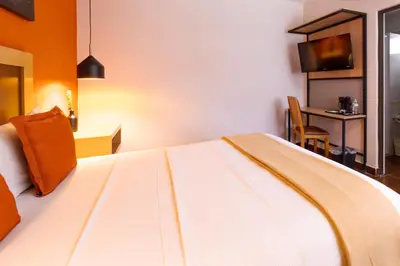 Cama o camas de una habitación en Hotel Buen Valle