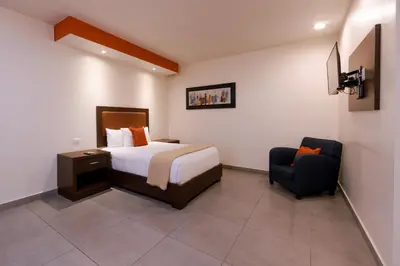 Cama o camas de una habitación en Hotel Buen Valle
