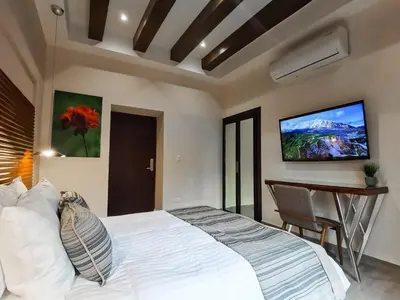 Cama o camas de una habitación en Hotel Plaza Cuatro Ciénegas