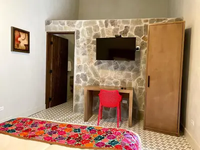Una televisión o centro de entretenimiento en Hotel Casa Nodin