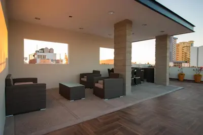 Zona de estar de Acogedor departamento Boho cerca de la playa