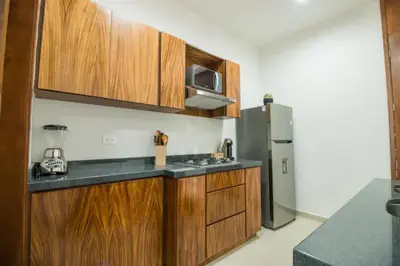 Una cocina o zona de cocina en Acogedor departamento Boho cerca de la playa