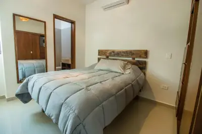 Cama o camas de una habitación en Amplio departamento Modern Boho cerca de la playa