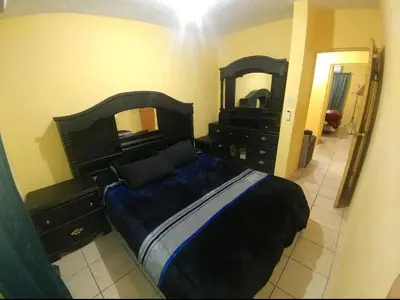 Cama o camas de una habitación en Casa Vicky Alojamiento para vacaciones y trámites consulares