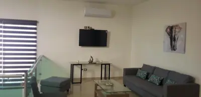 Una televisión o centro de entretenimiento en Casa en la playa