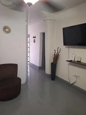 Una televisión o centro de entretenimiento en Casa en La zona Centro de la Ciudad