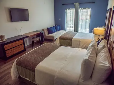 Cama o camas de una habitación en Sawari Hotel