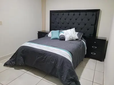 Cama o camas de una habitación en Apartamentos Milenario
