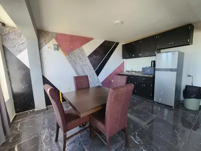 Una cocina o zona de cocina en Apartamentos Milenario